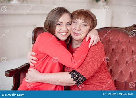 Mature Mother And Daughter Hugging Stock Image Image Of Mature Home