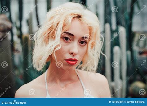 Fashion Portrait Of Beautiful Young Woman In Tropical Forest Stock