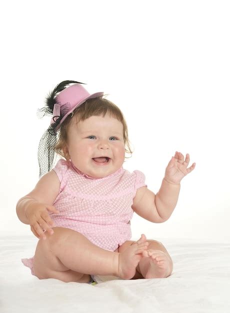 Premium Photo Adorable Baby Girl In Pink Clothes On A White Background