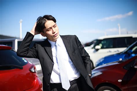 Free Stock Photo Of Man Standing With Arms Raised In Parking Lot