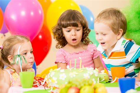 Kids Celebrate Birthday Party Blowing Candles Stock Photo - Image of ...