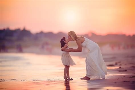 Mom Kissing Daughter On The Beach By Tracy Sweeney Click Magazine