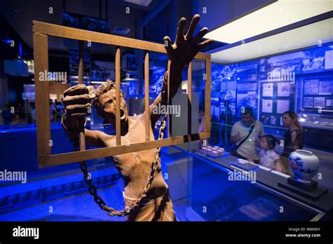 Visitors Look At Sculptures At The Memorial Hall Of The Victims In