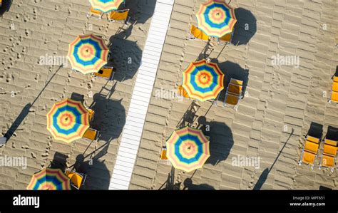 Bird's eye view of colored umbrella in a beach in italy, Tuscany ...