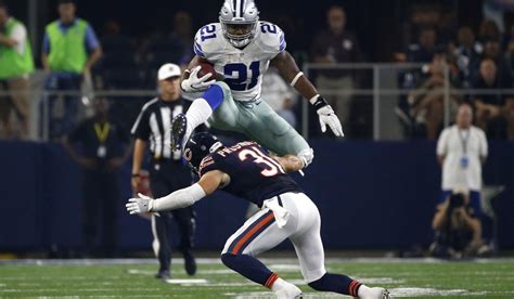 Dallas Cowboys Running Back Ezekiel Elliott 21 Leaps Over A Tackle