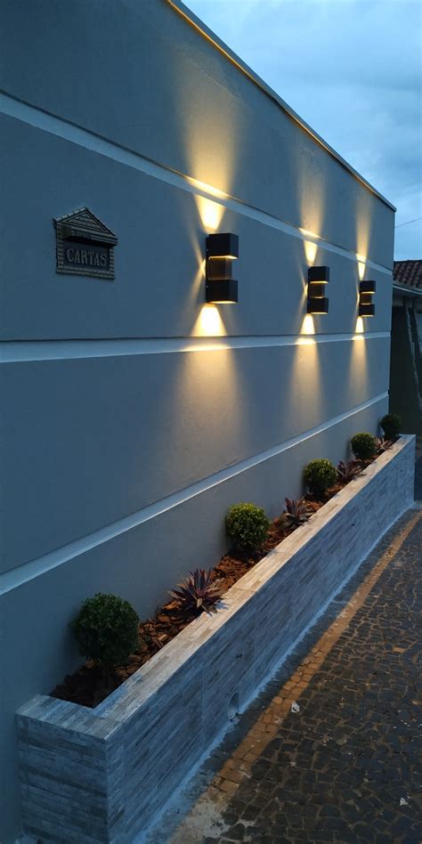 Modern House Exterior With Planters And Lights