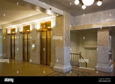 Horizontal View Of The Gold Elevators And Elegant Decoration Of The