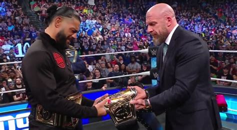 Triple H Presents Roman Reigns With New Universal Title On Wwe