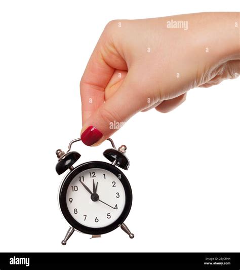 Female Hand Holding Alarm Clock On White Background Stock Photo Alamy