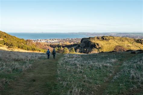 Two Hikers Walking In Holyrood Park Edinburgh Scotland Editorial