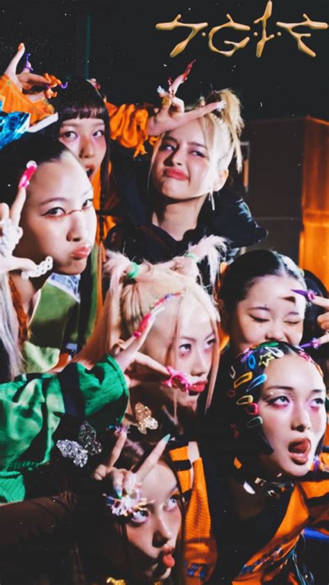 The Girls Are Posing For A Photo Together With Their Hands In The Air
