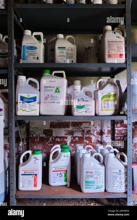 Agrochemicals Pesticides Stacked 3 High On Metal Shelving In A Farm