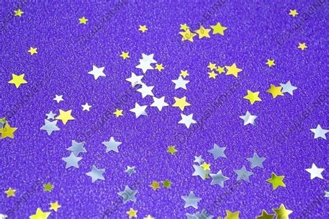 Abstract purple glitter background with stars confetti. JPG