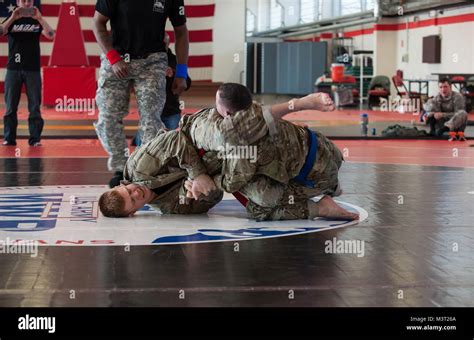 U S Air Force Staff Sergeant Joseph Everett Left Grapples Against U