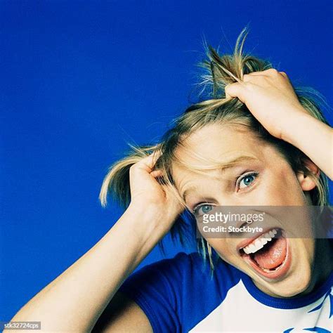 Pulling Up Hair Photos And Premium High Res Pictures Getty Images