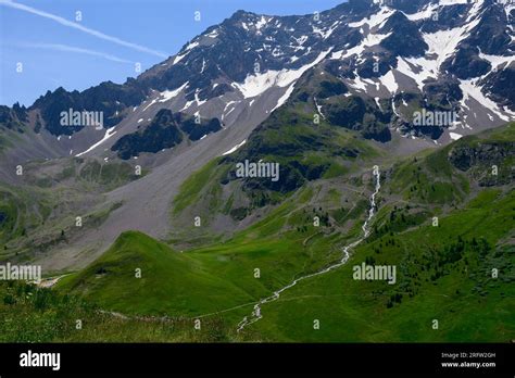 Mountains And Green Alpine Meadows Views Near Col Du Lautaret Massif