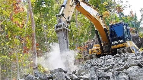 Excavator With Hydraulic Hammer Breaking Rock Cat D Youtube