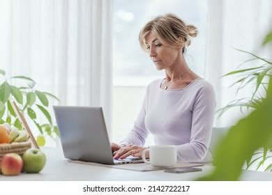 Mature Woman Working Home She Connecting Stock Photo Shutterstock