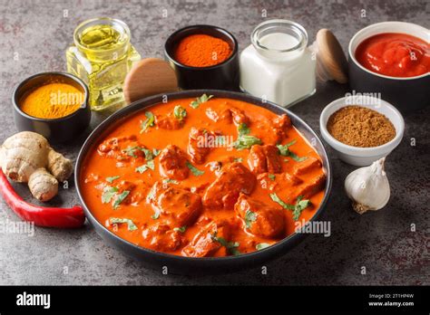 Traditional Indian British Dish Chicken Tikka Masala With Spicy Curry Meat In Creamy Gravy Over