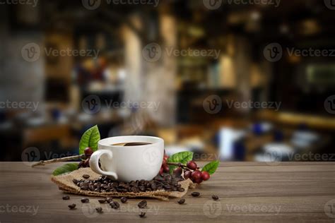 Hot Coffee cup with fresh organic red coffee beans and coffee roasts on
