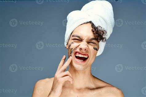 Guy With A Towel On His Head Face Cream Skin Care Stock Photo