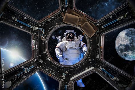 astronaut and the earth view from the spaceship "Elements of this image furnished by NASA" Stock ...