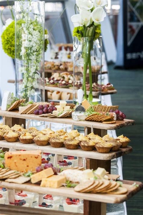 Food Display With Local Fresh Cheeses Pastries Crackers And Fresh