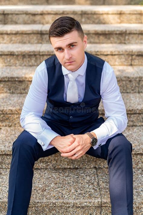 Handsome Young Groom Wearing Elegant And Stylish Dark Blue Suit