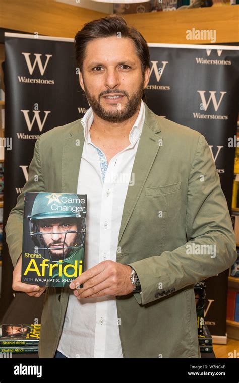 Former Pakistan Cricket Captain, Shahid Afridi, signs copies of his new ...