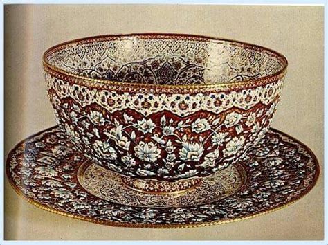 An Ornately Decorated Cup And Saucer With Matching Saucers On The Side