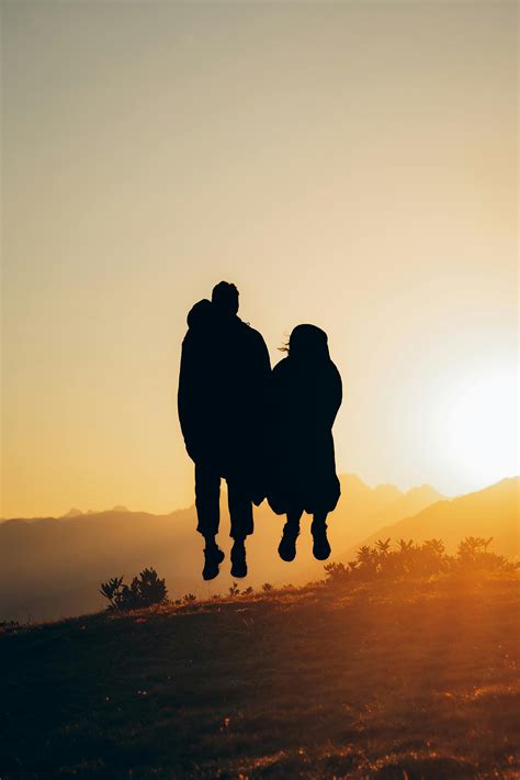 Silhouette of Couple Wearing Cowboy Hats During Sunset · Free Stock Photo