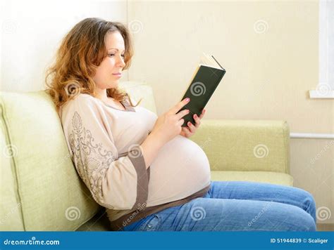 Cute Pregnant Woman Reading A Book At Home Stock Image Image Of Happy