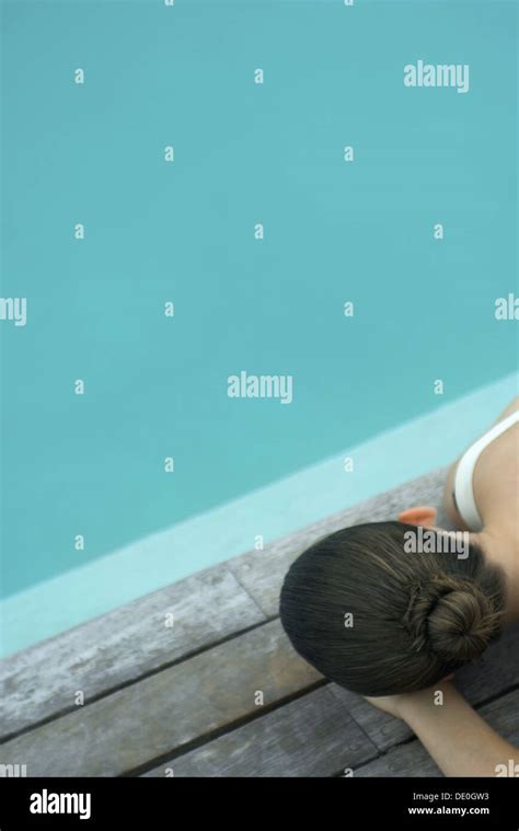 Woman Lying On Deck Next To Pool Stock Photo Alamy