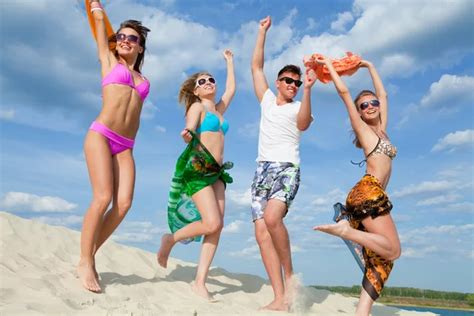 Happy people on beach — Stock Photo © yanlev #73727631