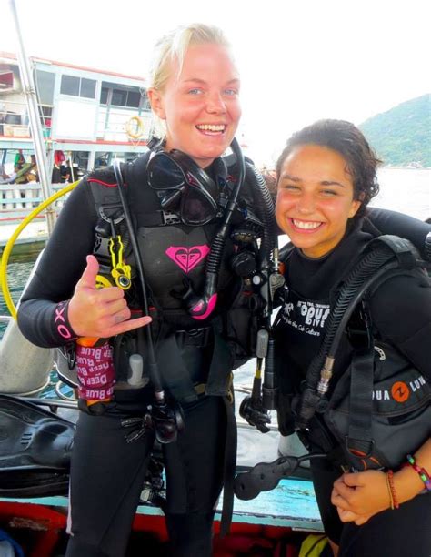 Two Women In Scuba Gear Posing For The Camera