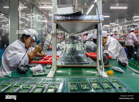 File Chinese Workers Manufacture Electric Products On The Assembly