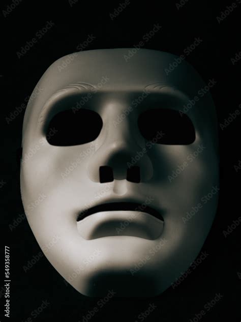 A white mask on a black background is the symbol of the attacking ...