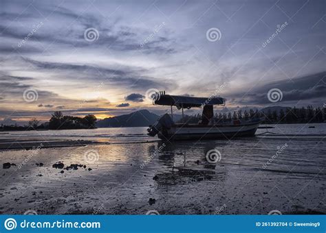 Sunset Scene Of The Fishing Boats Harbored At The Seaside Stock Photo