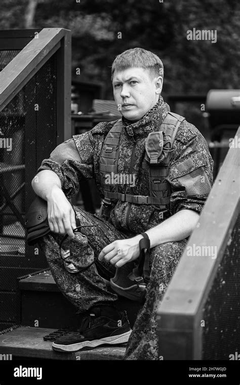 Fully Equipped Military Men With Automatic Weapons Getting Ready To