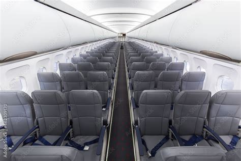 Typical interior of a passenger plane Airbus A320 Stock Photo | Adobe Stock