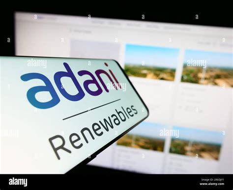 Cellphone with logo of Indian company Adani Green Energy Limited on ...