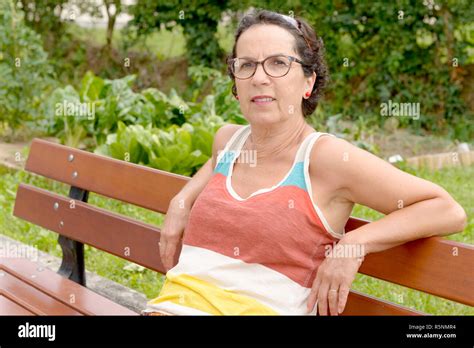 Portrait Of A Middle Aged Brunette Woman With Eyeglasses Outdoor Stock