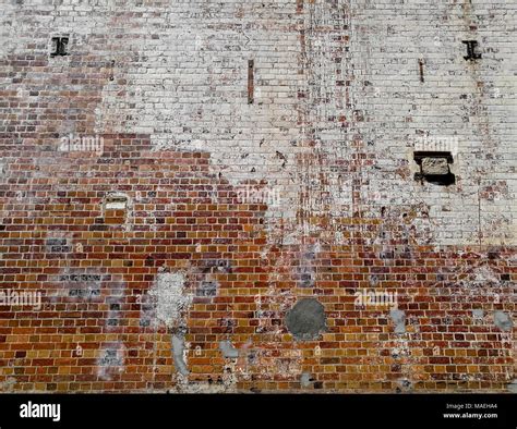 Damaged torn brick wall background Stock Photo - Alamy