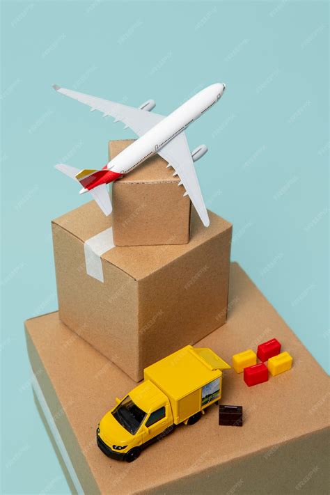 Free Photo High Angle Plane And Truck With Boxes
