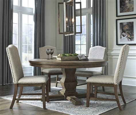 Johnelle Round Dining Table & 4 Chairs – Ashley Homestore