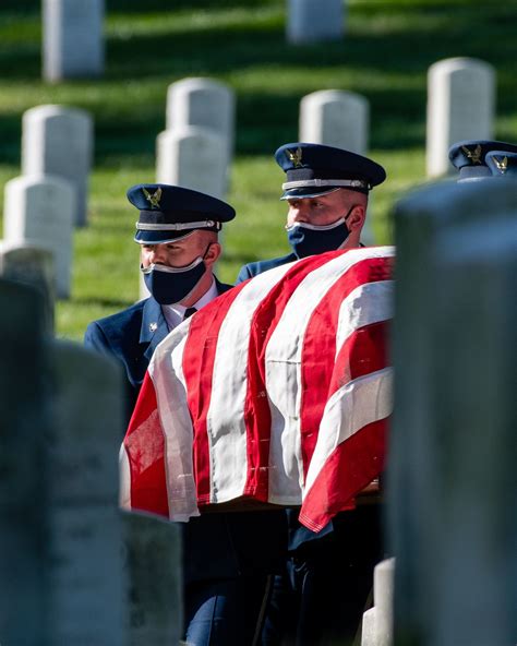 Members Of The Us Air Force Honor Guard Carry A Casket Through Section