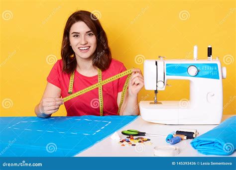 Close Up Portrait Of Young Creative Designer Sewing Clothes On Sewing