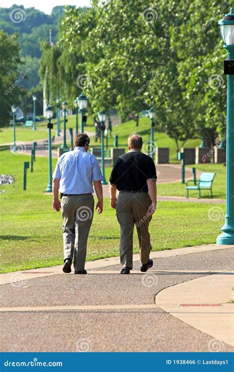 Two Men Walking Stock Photo Image Of Blue Busy Body 1938466