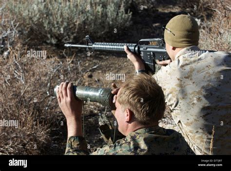 Us Marine Help Another Marine Using Spotting Scope Aiming M16 Target