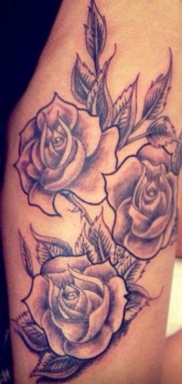 A Woman S Arm With Three Roses On It